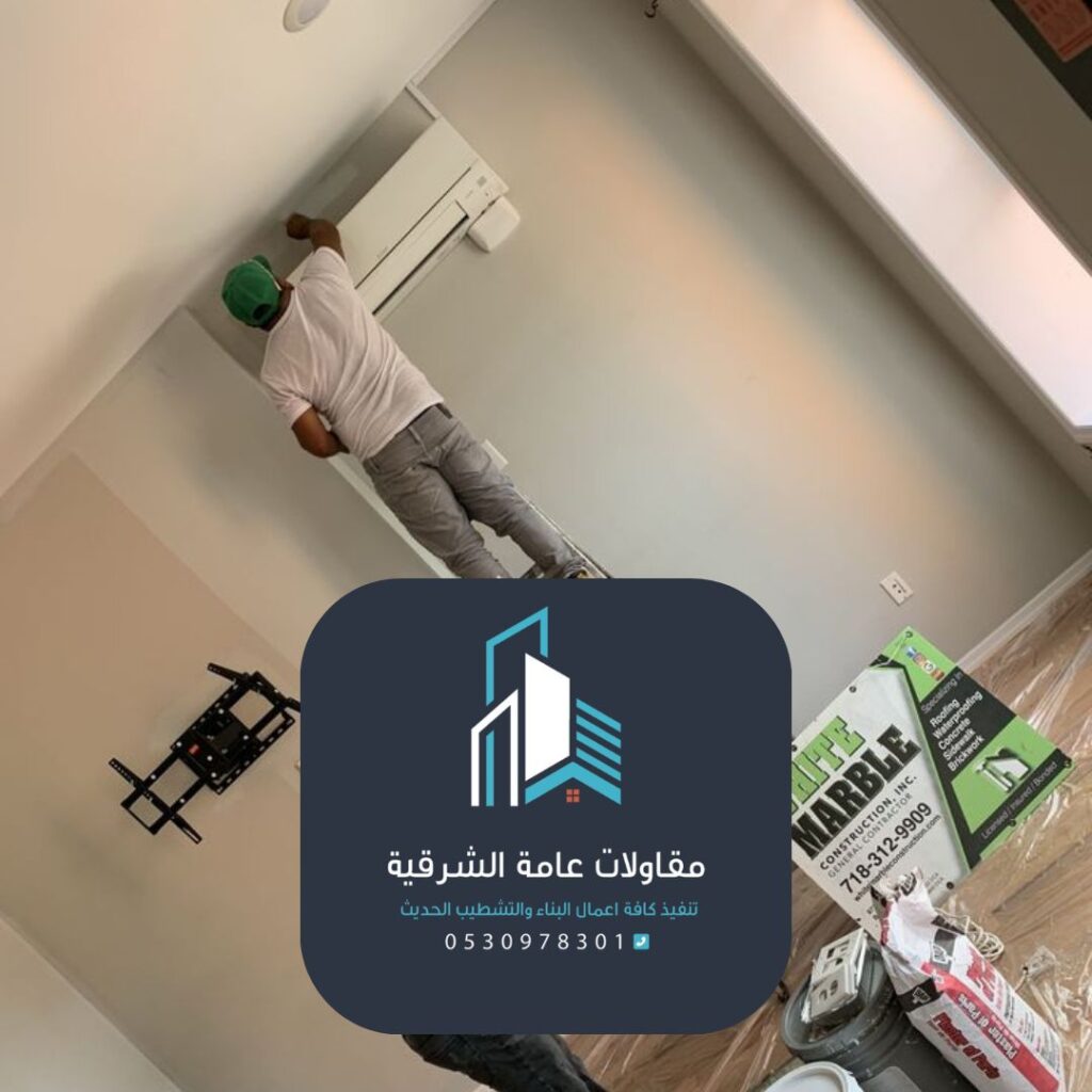 صباغ محترف في الدمام يجدد واجهة مبنى تجاري